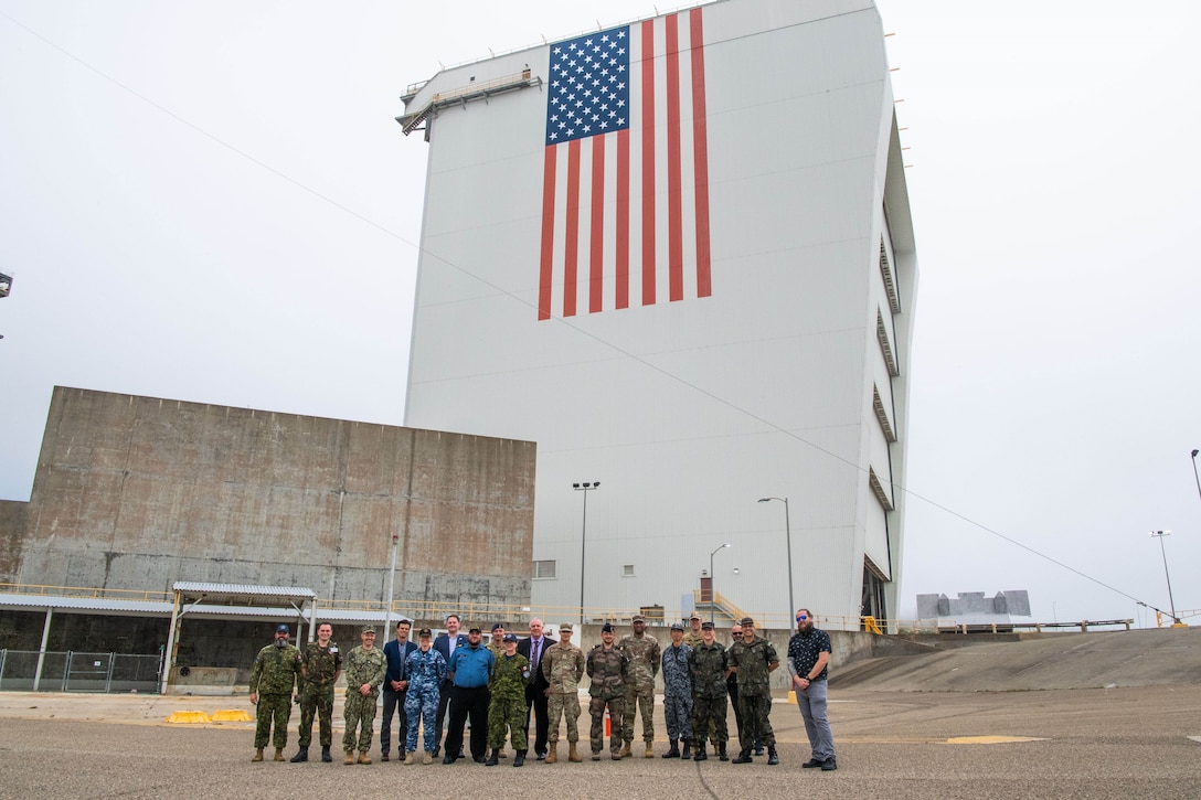 Coordinators and participants of the Global Sentinel 2024 Mid-Planning Conference stand together for a group photo and Space Launch Complex-6 on Vandenberg Space Force Base, Calif., June 29, 2023. Global Sentinel is USSPACECOM’s single largest multinational event and leading security cooperation effort designed to strengthen partnerships with other space-faring nations, improve operational collaboration, and promote responsible behavior in the space domain. (U.S. Space Force photo by Capt. Blythe Goya)