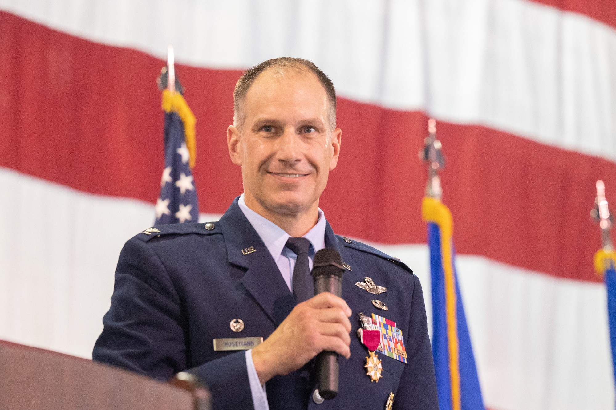Col. Matthew S. Husemann, 436th Airlift Wing commander, gives his final farewell before relinquishing command during the 436th AW Change of Command ceremony at Dover Air Force Base, Delaware, July 7, 2023. Husemann relinquished command to Col. William C. McDonald in a ceremony attended by family, friends, distinguished visitors, local civic leaders and members of Team Dover. (U.S. Air Force photo by Mauricio Campino)