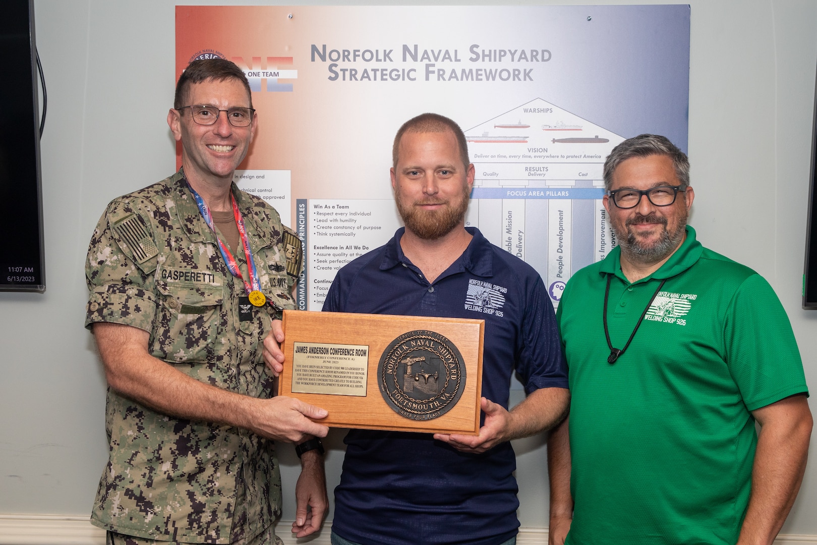 Norfolk Naval Shipyard's Code 900 Production Resource Officer, Capt. Frank Gasperetti, congratulated Code 926 Workforce Development Lead Mr. James Anderson for receiving the honor to have the Production Resource Office conference room named after him for the month of June 2023. Anderson was chosen because of his passion for building an effective workforce development program and his commitment to building and improving the program for Code 926 and all the trades in Code 900.