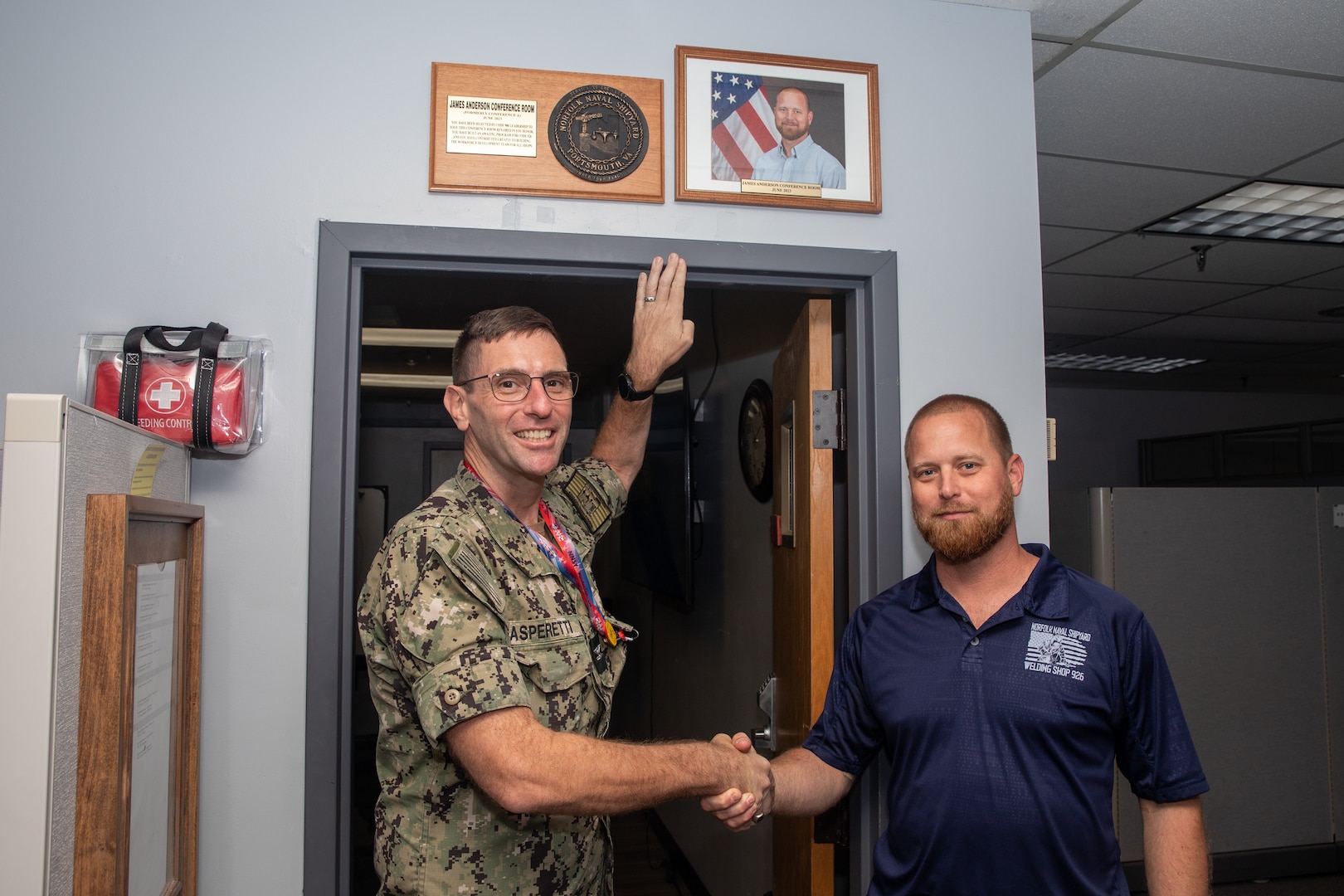 Norfolk Naval Shipyard's Code 900 Production Resource Officer, Capt. Frank Gasperetti, congratulated Code 926 Workforce Development Lead Mr. James Anderson for receiving the honor to have the Production Resource Office conference room named after him for the month of June 2023. Anderson was chosen because of his passion for building an effective workforce development program and his commitment to building and improving the program for Code 926 and all the trades in Code 900.