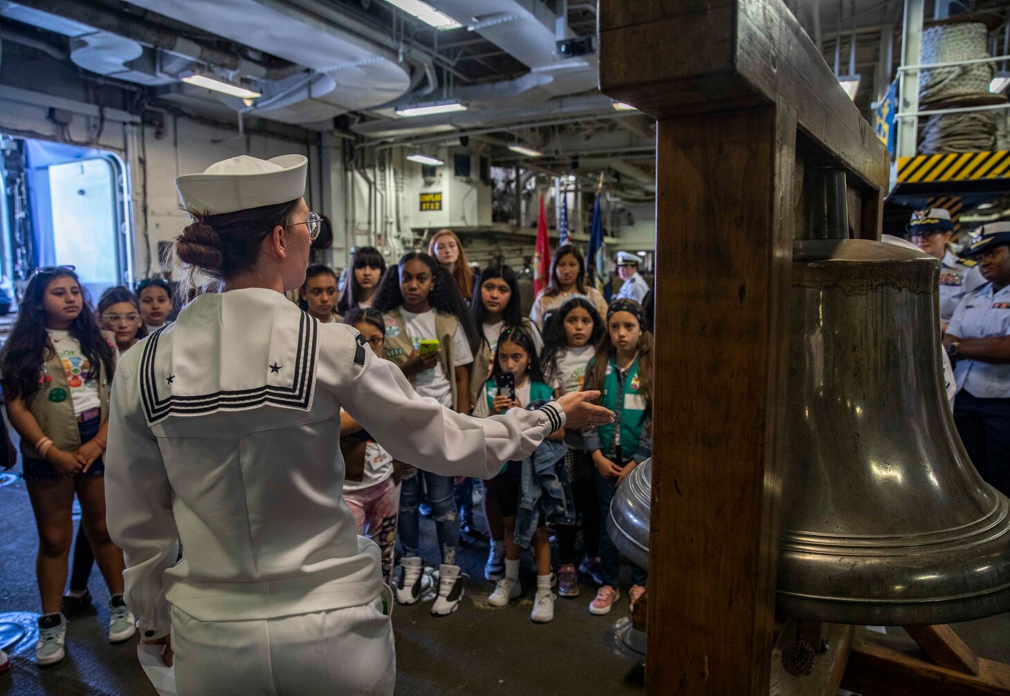 A Sailor Speaks to a group of Girl Scouts