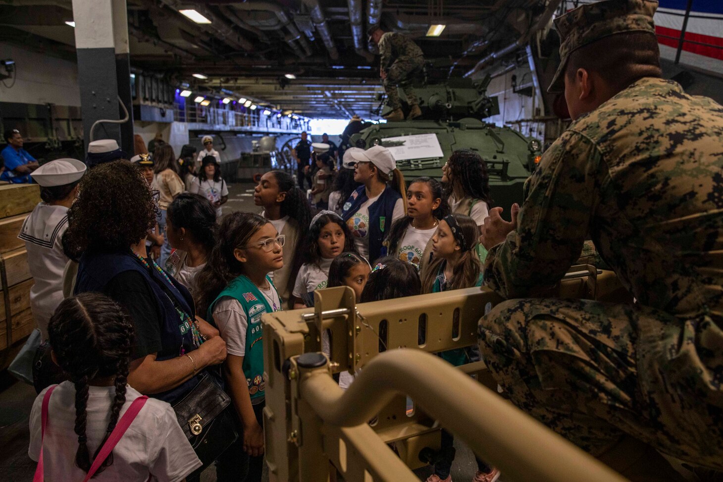 Marine speaks to a group of girl scouts