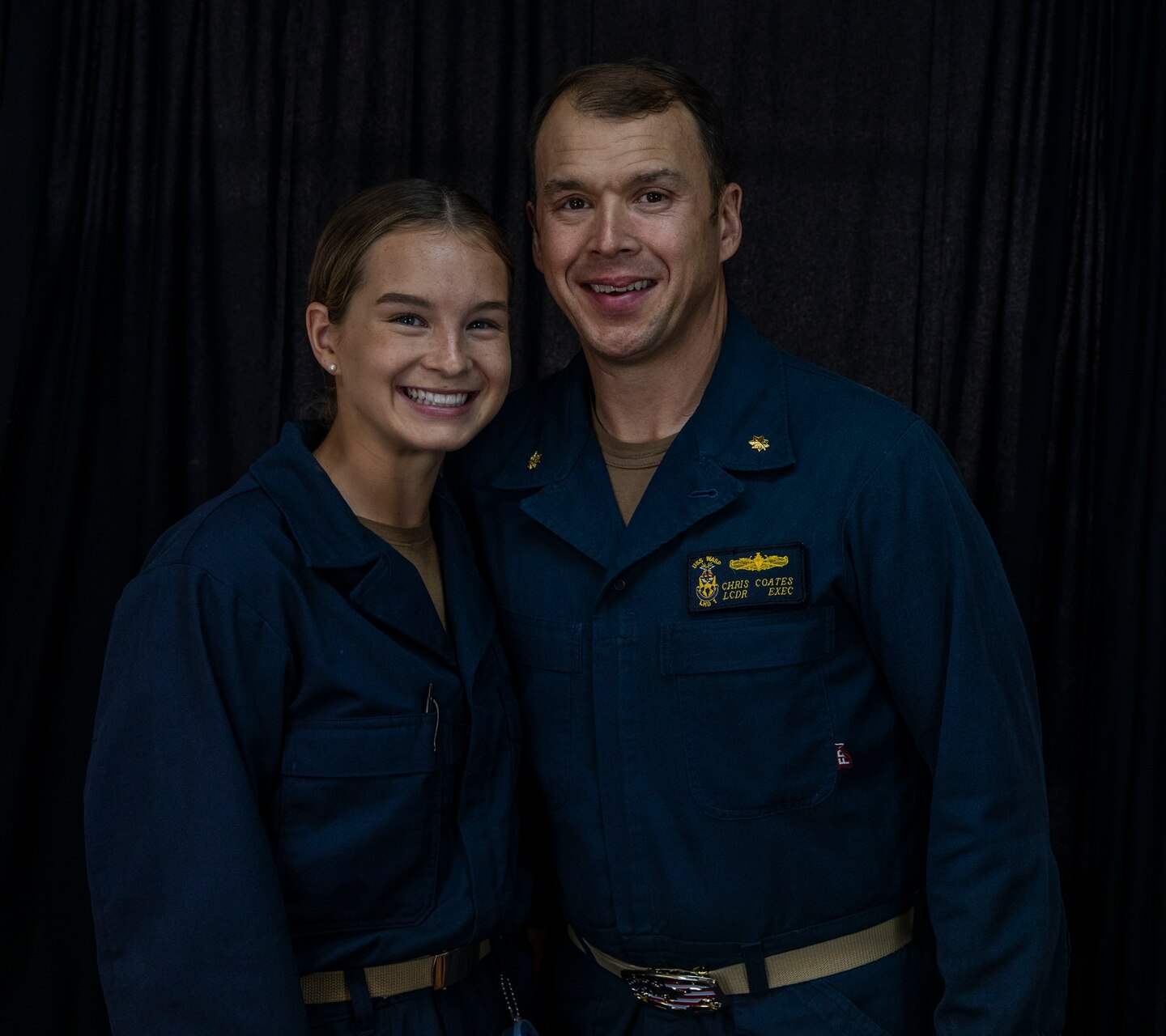 Father and Daughter stand next to each other