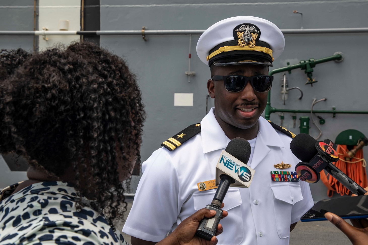 Members of the media interview Officer aboard Wasp