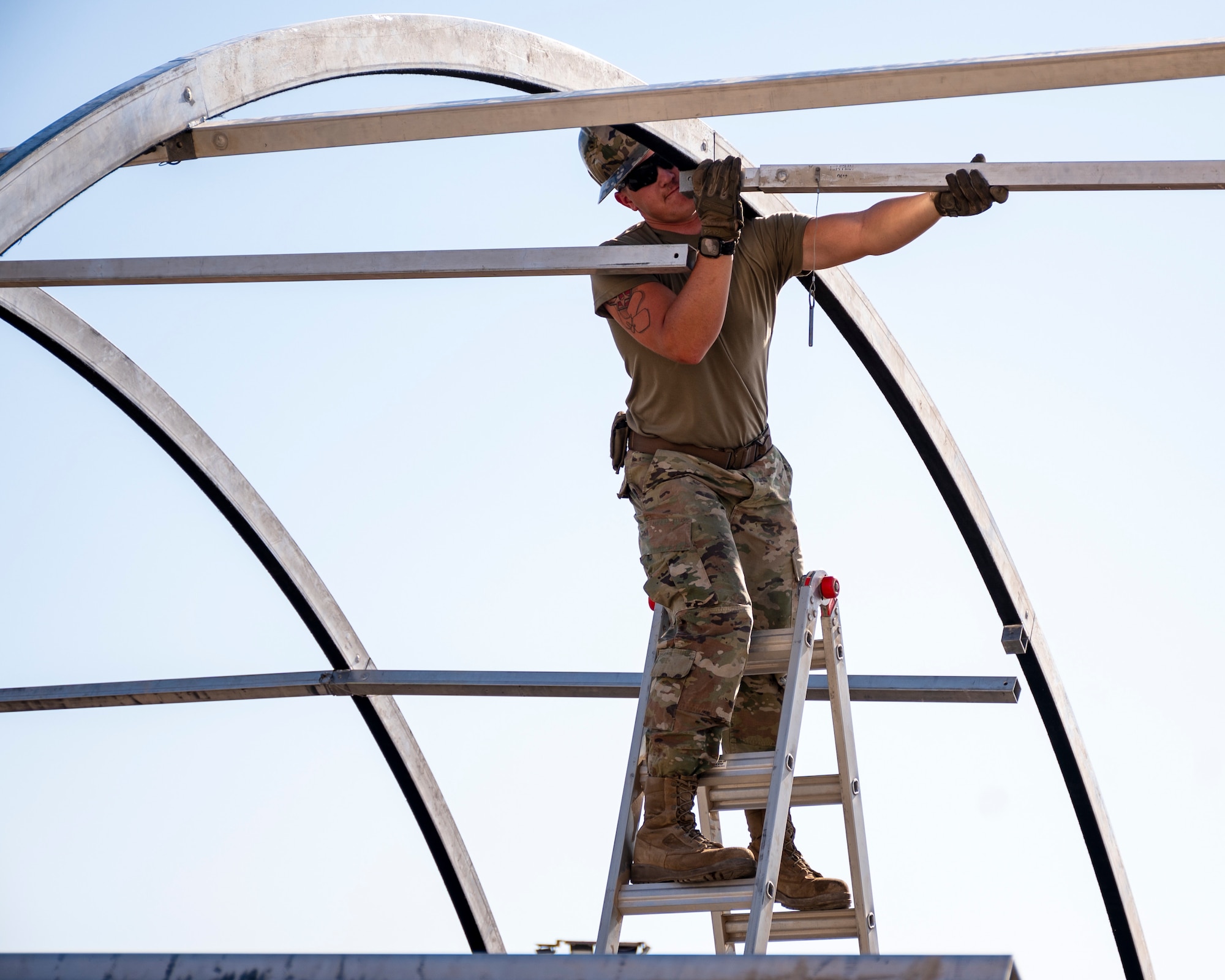 U.S. Air Force service members from the 386th Expeditionary Civil Engineer Squadron Dirt Boyz, receive training on the construction of a medium-sized shelter (MSS) at Ali Al Salem Air Base, Kuwait, July 6, 2023.
