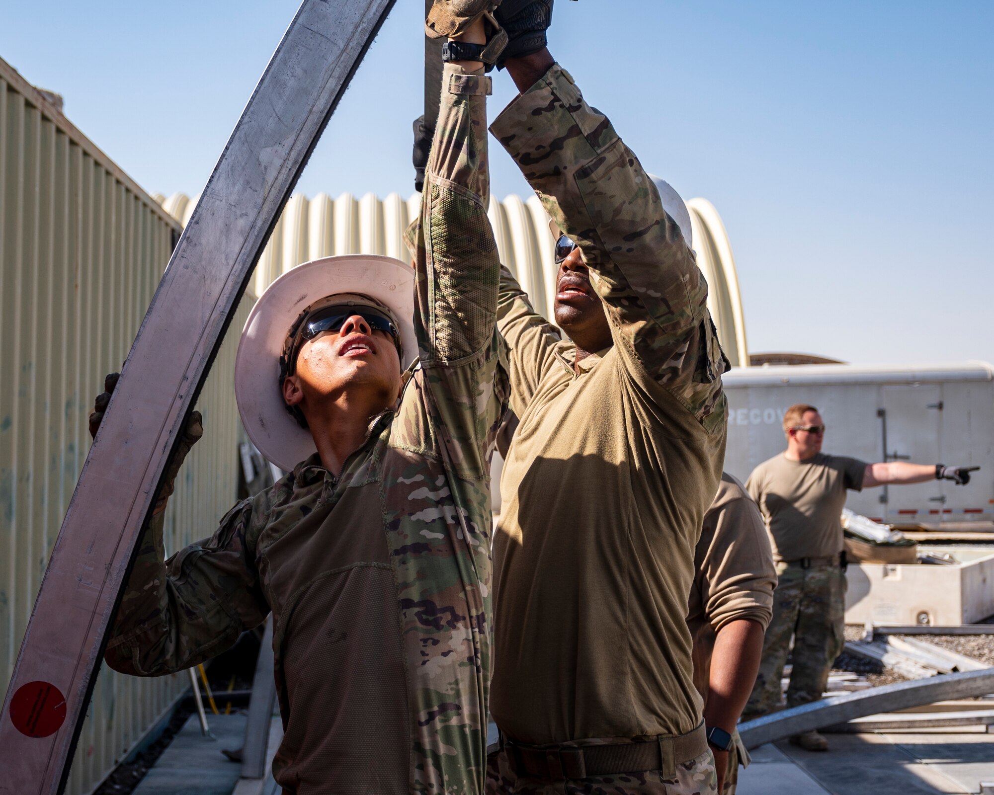 U.S. Air Force service members from the 386th Expeditionary Civil Engineer Squadron Dirt Boyz, receive training on the construction of a medium-sized shelter (MSS) at Ali Al Salem Air Base, Kuwait, July 6, 2023.
