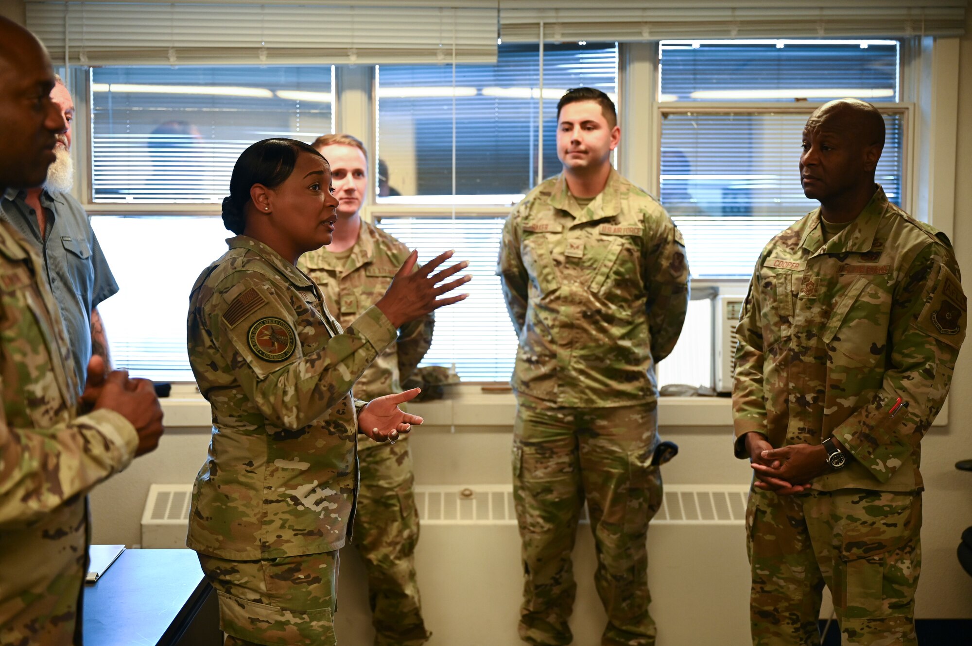 A woman speaks to a group.