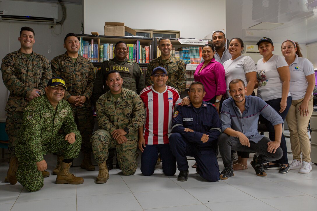 U.S. Marines with 4th Civil Affairs Group, Force Headquarters Group, in support of Special Purpose Marine Air-Ground Task Force UNITAS LXIV, pose for a photo with Rafael Ospina Toscano, mayor of Coveñas, along with other civilian leaders in Coveñas, Colombia, July 11, 2023. By meeting with local leaders, Marines forge bonds for the long-term advancement of regional security, maintaining favorable partnerships that deter aggression and supporting the stability that generates economic growth. UNITAS focuses on strengthening existing regional partnerships and encouraging the establishment of new relationships through the exchange of maritime mission-focused knowledge and expertise. (U.S. Marine Corps photo by LCpl. Samuel Qin)