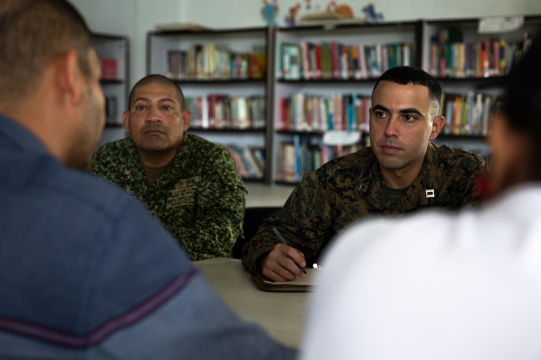 U.S. Marine Corps Capt. Darcos Cruz, 4th Civil Affairs Group, Force Headquarters Group in support of Special Purpose Marine Air-Ground Task Force UNITAS LXIV, meet with Rafael Ospina Toscano, mayor of Coveñas, along with other civilian leaders in Coveñas, Colombia, July 11, 2023. By meeting with local leaders, Marines forge bonds for the long-term advancement of regional security, maintaining favorable partnerships that deter aggression and supporting the stability that generates economic growth. UNITAS focuses on strengthening existing regional partnerships and encouraging the establishment of new relationships through the exchange of maritime mission-focused knowledge and expertise. (U.S. Marine Corps photo by LCpl. Samuel Qin)