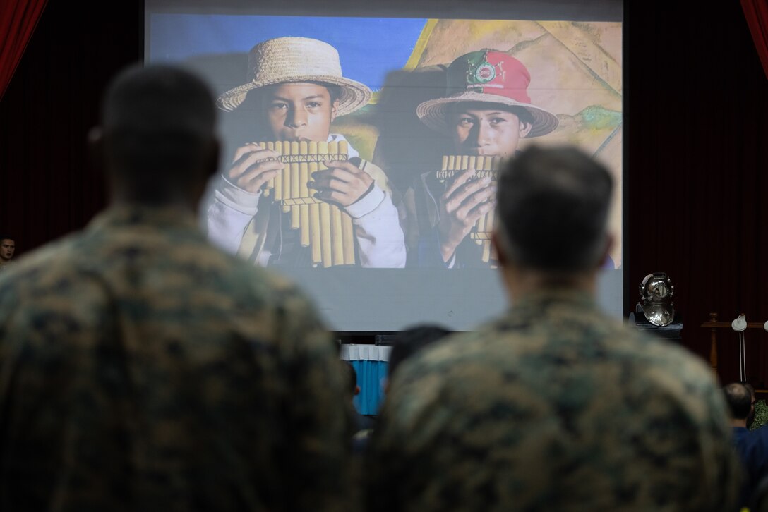 U.S. Marines and Sailors from Combat Logistics Battalion 8, Combat Logistics Regiment 2, 2nd Marine Logistics Group, in support of Special Purpose Marine Air-Ground Task Force UNITAS LXIV, watch the exercises’ culminating video alongside members of 8 different foreign nations during the closing ceremony of exercise SOLIDAREX, aboard Escuela de Formación de Infantería Marina Coveñas in Coveñas, Colombia, July 10, 2023. Twelve ships from eight countries participated in the humanitarian assistance exercise designed to train a multinational task force to respond to large-scale emergencies. This was the largest exercise of this kind in the Caribbean. (U.S. Marine Corps photo by Sgt. Juan Carpanzano)
