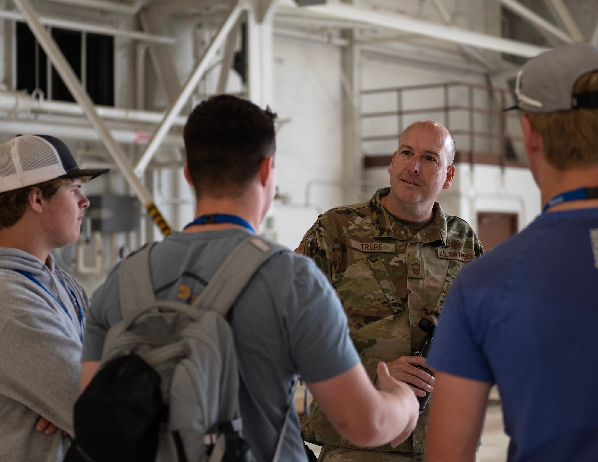 U.S. Air Force Senior Master Sgt. Heath Trupe, 133rd Maintenance Squadron, talks to Minnesota Aviation Career Education Camp students in St. Paul, Minn., June 15, 2023.