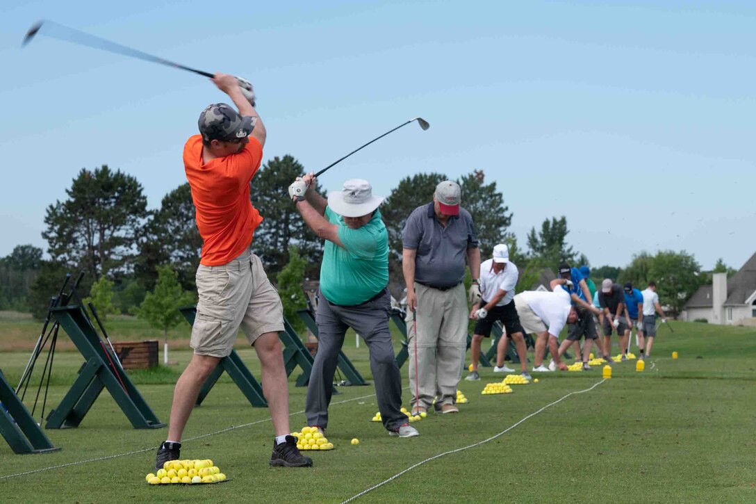 Current and former members of the 914th Air Refueling Wing and 107th Attack Wing take to the driving range to practice for the 50th annual Niagara Reserve/Guard golf tournament at River Oaks Golf Club, Grand Island, New York, July 10, 2023.