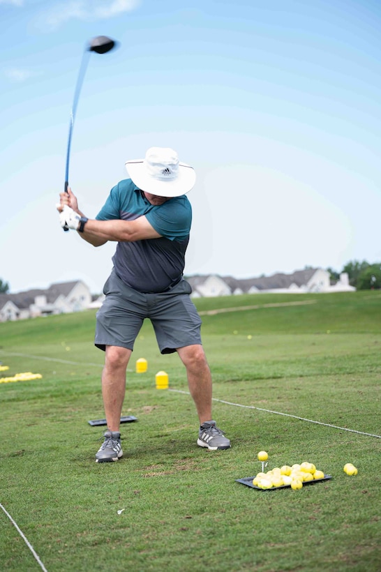 Master Sgt. Brian Estep, a member of the chaplain's team at the 914th Air Refueling Wing, takes a practice swing at the 50th annual Niagara Reserve/Guard golf tournament at River Oaks Golf Club, Grand Island, New York, July 10, 2023.