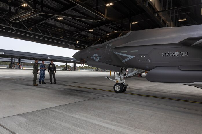 U.S. Marine Corps Lt. Col. Michael O’Brien, Commanding Officer of Marine Fighter Attack Squadron 314, Marine Aircraft Group 11, 3rd Marine Aircraft Wing, discusses the capabilities of a U.S. Marine Corps F-35C Lightning II aircraft with Air Commodore Peter Robinson, Commander of Air Combat Group, Royal Australian Air Force, and Wing Commander Adrian Kiely, Commanding Officer of RAAF No. 3 Squadron, while touring RAAF Base Williamtown, New South Wales, Australia, June 28, 2023. The tour allowed for U.S. Marine Corps and Australian military leadership to view on-going unit-level and bilateral training events designed to enhance U.S.-Australian relationships and further develop and sustain capabilities in the Indo-Pacific Region. O’Brien is a Harrisburg, Pennsylvania native.