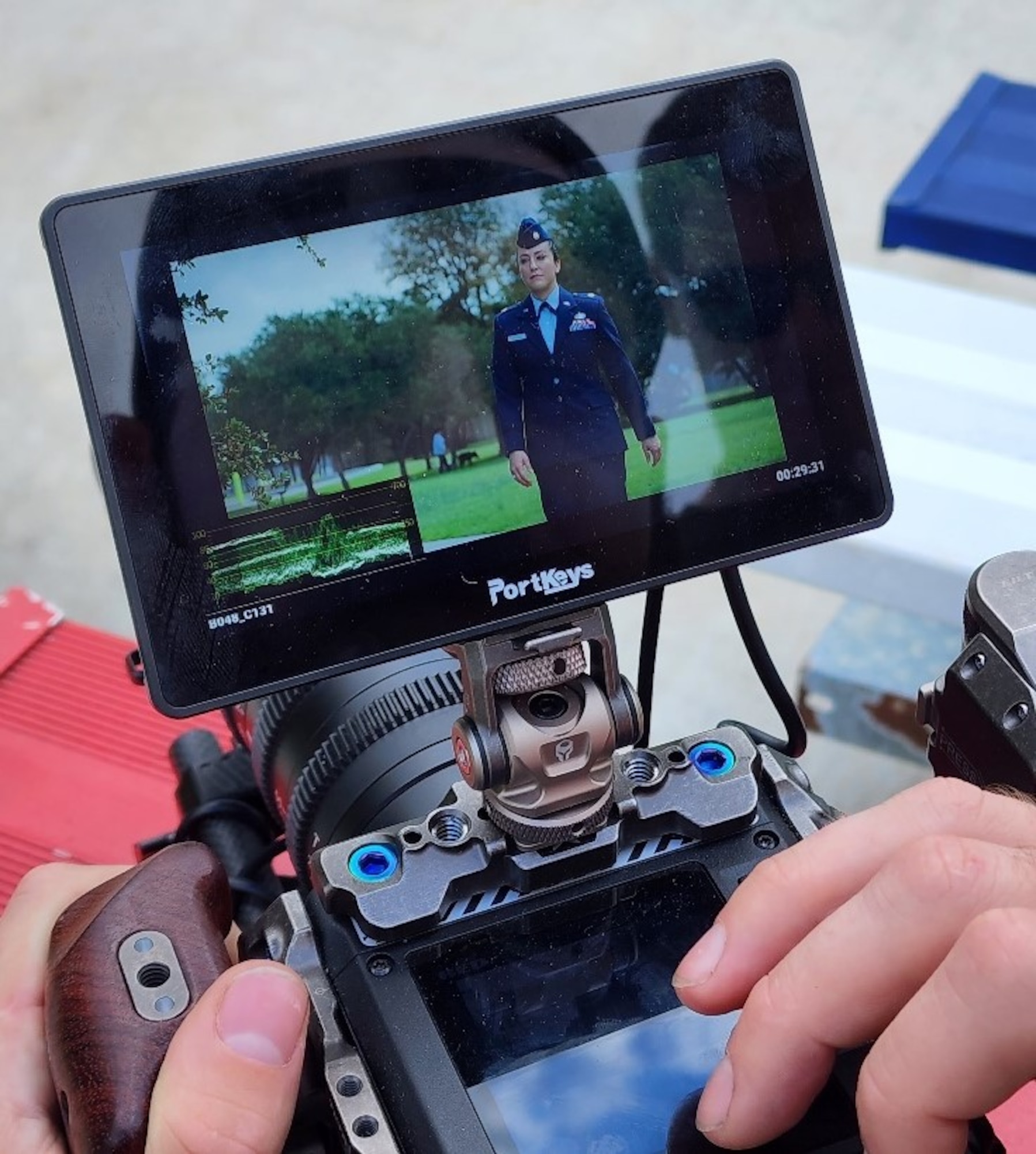 U.S. Air Force Maj. Lindsay Cordero, Air Force Global Strike Command Commander’s Action Group legislative liaison officer, is filmed in her service dress for her episode of Artisan Air prior to her art gallery exhibition beginning, in Austin, Texas, on November 10, 2022. The Air Force Service Center’s newest season of Artisan Air features 30-minute episodes, with Cordero’s episode focusing on her mission of bringing feelings of joy and belonging through her art and writing, which focuses on children’s literacy, conservation, and mental health. (U.S. Air Force courtesy photo)