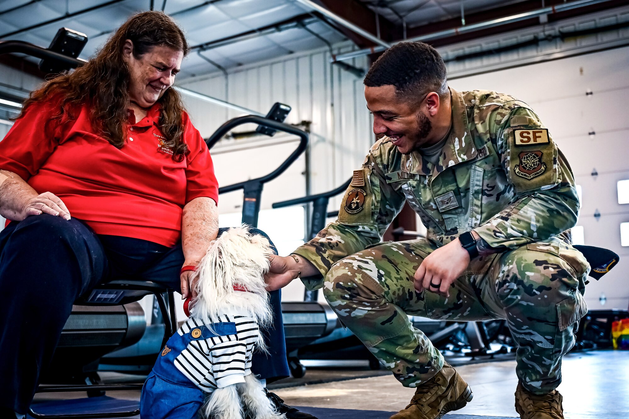 Service members, their families, and volunteers with the Bright and Beautiful Therapy Dogs organization interact with K-9s during a visit to Joint Base McGuire-Dix-Lakehurst, N.J. on 23 June, 2023. Bright and Beautiful Therapy Dogs is a non-profit organization that trains, evaluates and qualifies dogs and their handlers to become certified therapy dog teams. Once certified, teams may visit nursing homes, assisted living facilities, homeless shelters, schools, libraries, universities, mental health facilities, and more. The visit was a first for the Joint Base, where support for Comprehensive Airman Fitness and the resiliency factor across the Joint Force remains a top-line priority for leadership.