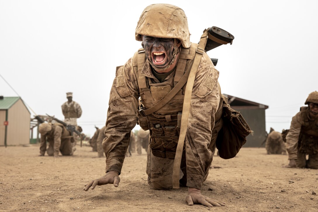 A U.S. Marine Corps recruit with Mike Company, 3rd Recruit Training Battalion, high crawls to an obtacle during the Crucible on Marine Corps Base Camp Pendleton, Calif., July 11, 2023. The Crucible is a 54-hour exercise where recruits apply the knowledge they have learned throughout recruit training, to earn the title of United States Marines. (U.S. Marine Corps photo by Sgt. Guyette)