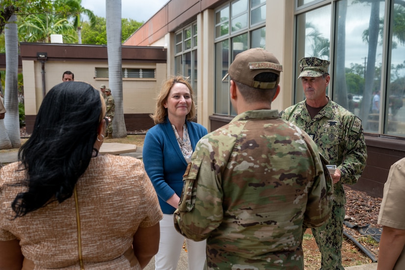 Deputy Secretary of Defense Kathleen Hicks greets a service member.