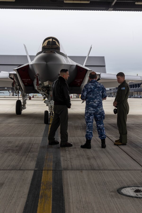 U.S. Marine Corps Lt. Col. Michael O’Brien, Commanding Officer of Marine Fighter Attack Squadron (VMFA) 314, Marine Aircraft Group 11, 3rd Marine Aircraft Wing, discusses the capabilities of a U.S. Marine Corps F-35C Lightning II aircraft with Air Commodore Peter Robinson, Commander of Air Combat Group, Royal Australian Air Force (RAAF), and Wing Commander Adrian Kiely, Commanding Officer of RAAF No. 3 Squadron, while touring RAAF Base Williamtown, New South Wales, Australia, June 28, 2023. The tour allowed for U.S. Marine Corps and Australian military leadership to view on-going unit-level and bilateral training events designed to enhance U.S.-Australian relationships and further develop and sustain capabilities in the Indo-Pacific Region. O’Brien is a Harrisburg, Pennsylvania native. (U.S. Marine Corps photo by Sgt. Joshua Brittenham)