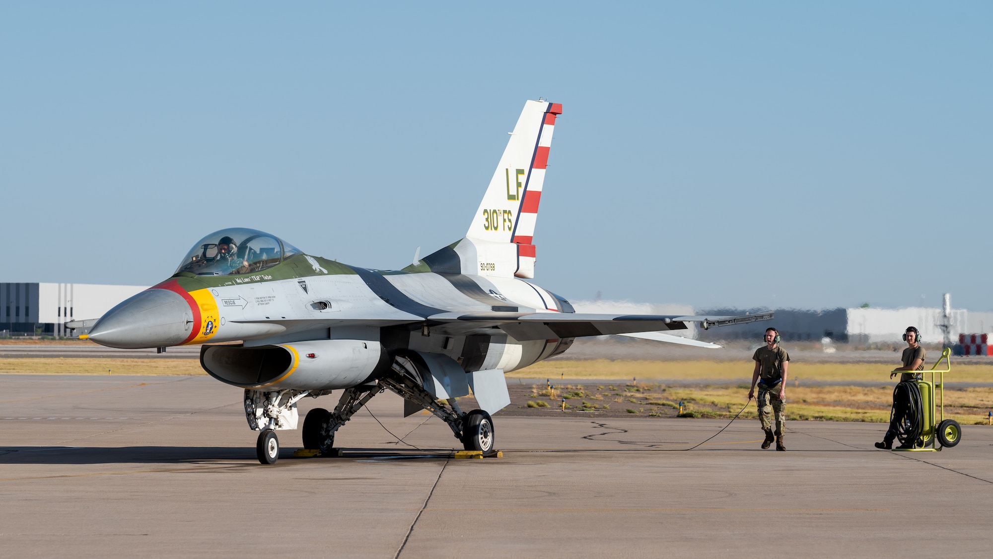 Crew chiefs assigned to the 309th Fighter Squadron prepare an F-16 Fighting Falcon for takeoff, July 10, 2023, at Luke Air Force Base, Arizona.