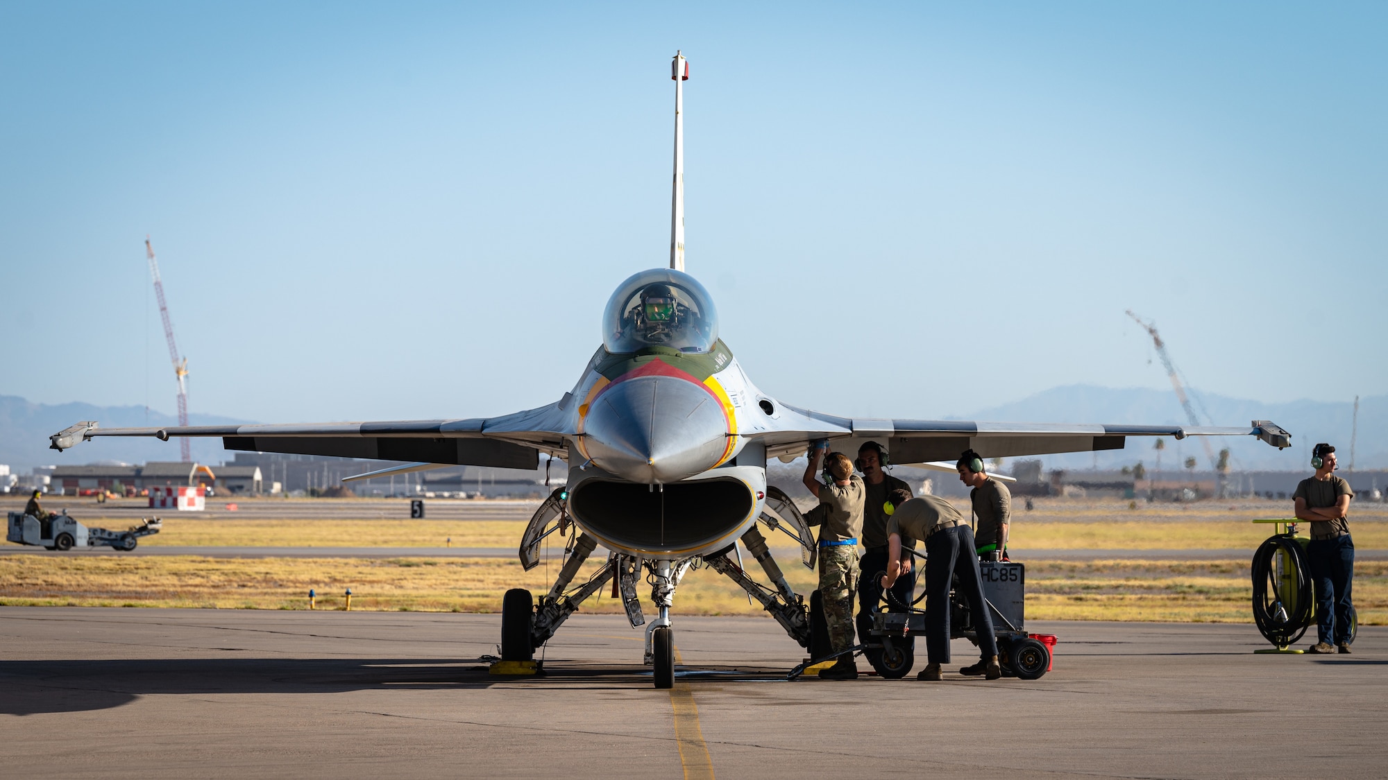 Crew chiefs assigned to the 309th Fighter Squadron prepare an F-16 Fighting Falcon for takeoff, July 10, 2023, at Luke Air Force Base, Arizona.