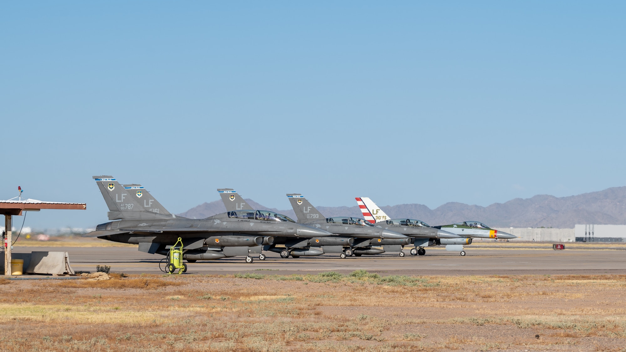 Five F-16 Fighting Falcons assigned to the 56th Fighter Wing prepare for takeoff at Luke Air Force Base, Arizona on July 10, 2023.