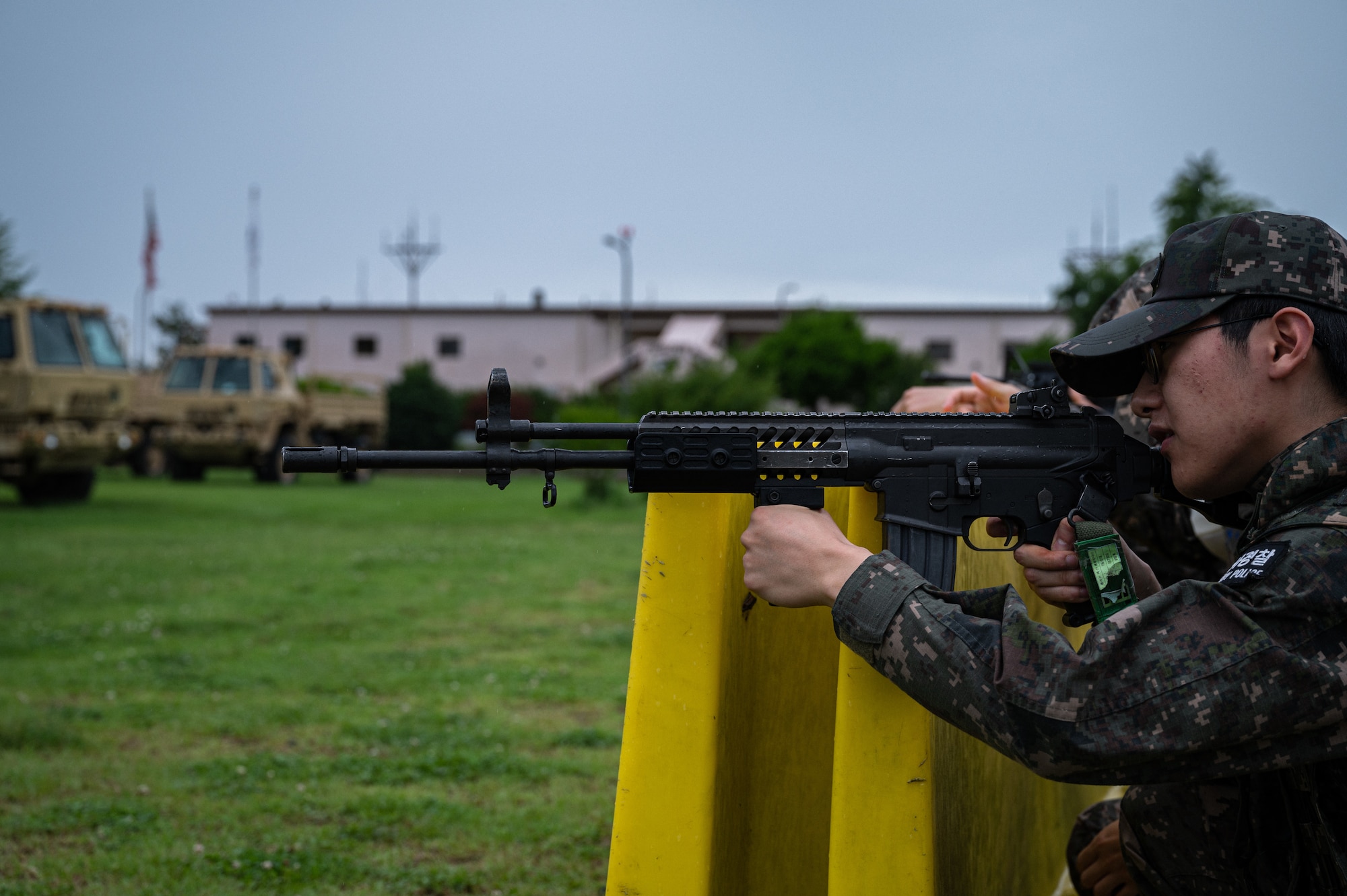 A Republic of Korea Air Force military policeman from the 38th Fighter Group rehearses guided movements and sighting combatants from a defensive firing position during a training event
