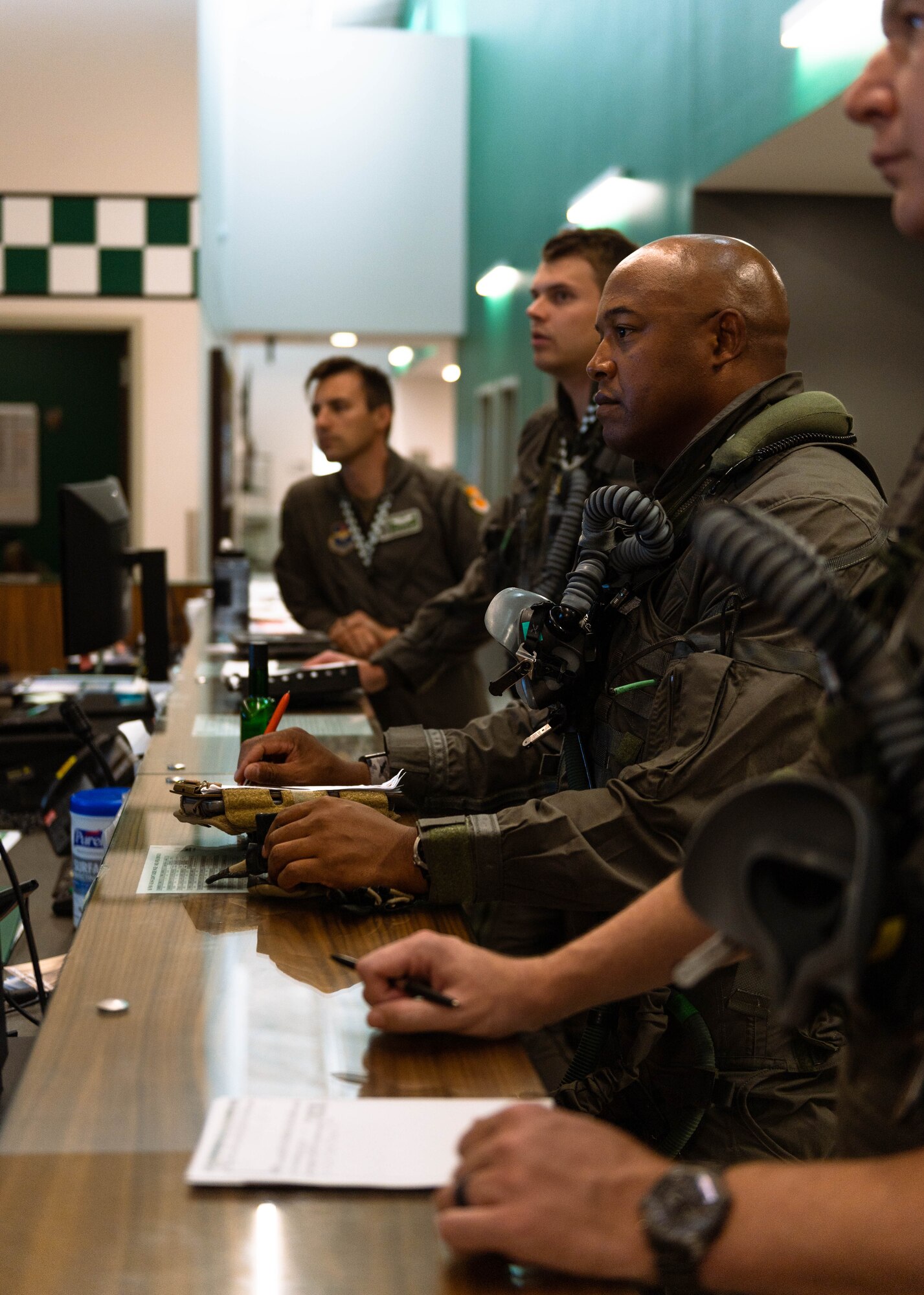 U.S. Air Force Lt. Col. Richard Peace, 187th Operations Support Squadron commander, receives a flight brief.