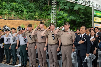 (Right to left) U.S. Eighth Army Commanding General Lt. Gen. Willard M. Burleson, III; outgoing U.S. Army Garrison Humphreys Commander Col. Seth C. Graves; incoming USAG Humphreys Commander Col. Ryan K. Workman; and Senior Enlisted Adviser Command Sgt. Maj. Monty C. Drummond salute during the playing of both the Korean and U.S. National Anthems during the Battle of Cheonan Commemoration Ceremony held at Martin Park in Cheonan City, July 8. The Battle of Cheonan marked the third engagement between U.S. and North Korean forces during the Korean War and took place July 7-8, 1950. The ceremony is in honor of U.S. Army Col. Robert R. Martin, the namesake of the park, who along with 108 U.S. Soldiers from the 34th Infantry Regiment perished in the battle. (U.S. Army photo by Kianna Scott)