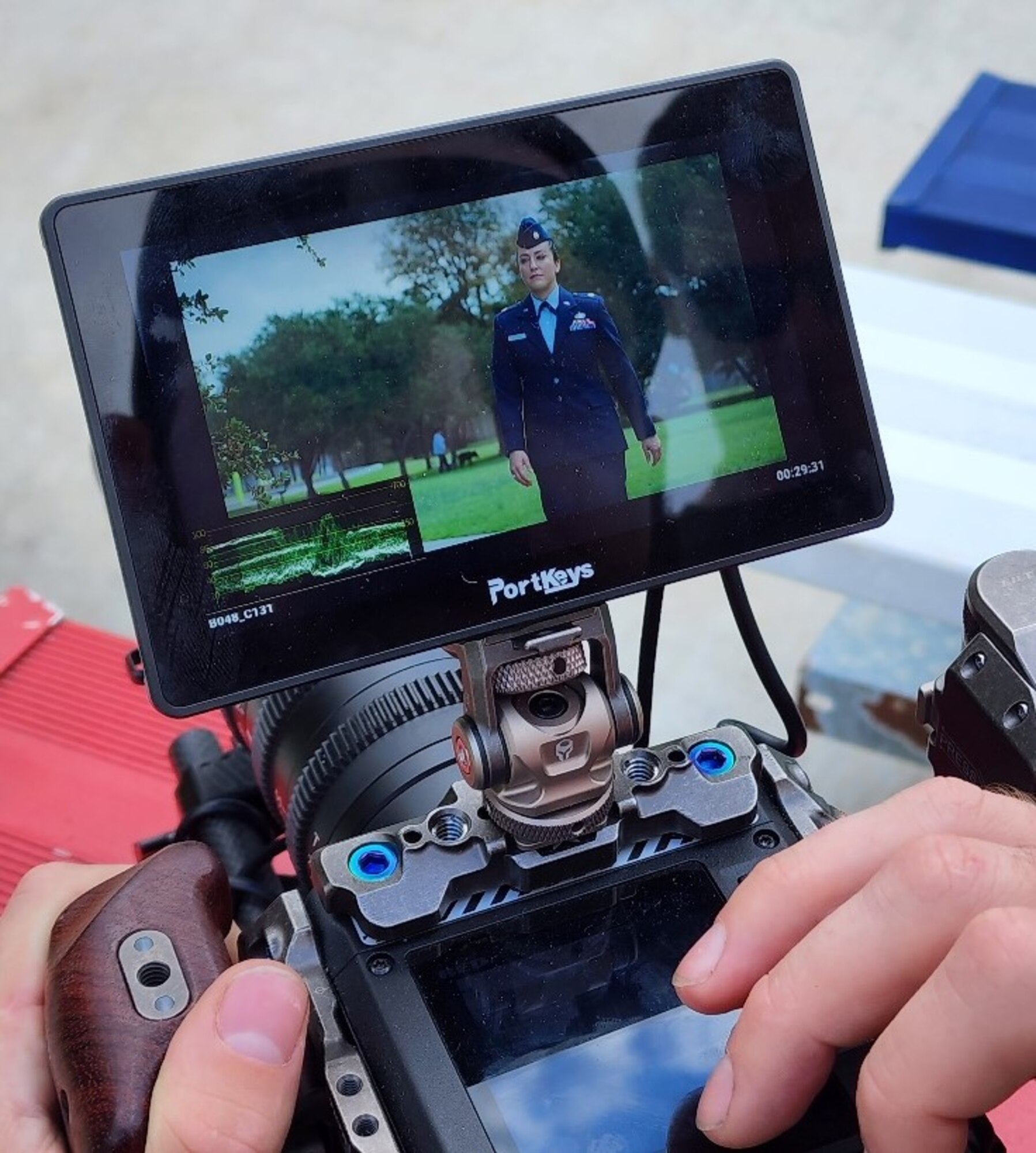 U.S. Air Force Maj. Lindsay Cordero, Air Force Global Strike Command Commander’s Action Group legislative liaison officer, is filmed in her service dress for her episode of Artisan Air prior to her art gallery exhibition beginning, in Austin, Texas, on November 10, 2022. The Air Force Service Center’s newest season of Artisan Air features 30-minute episodes, with Cordero’s episode focusing on her mission of bringing feelings of joy and belonging through her art and writing, which focuses on children’s literacy, conservation, and mental health. (U.S. Air Force courtesy photo)