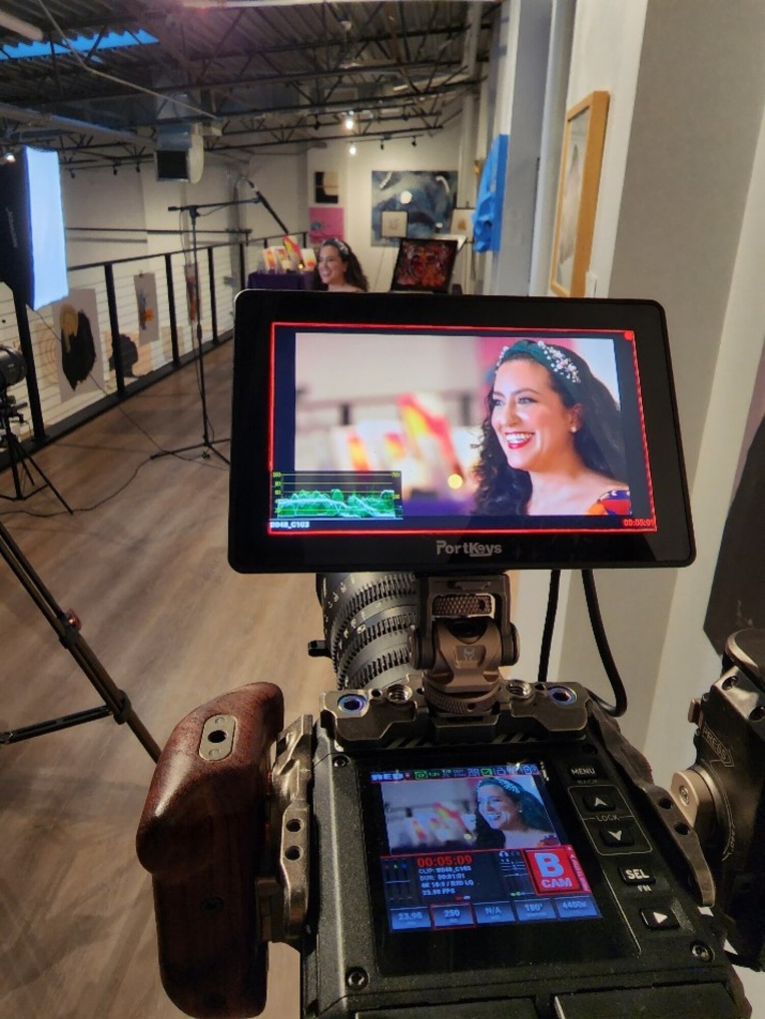 U.S. Air Force Maj. Lindsay Cordero, Air Force Global Strike Command Commander’s Action Group legislative liaison officer, is filmed for her episode of Artisan Air, at her art gallery exhibition in Austin, Texas, on November 9, 2022. The Air Force Service Center’s newest season of Artisan Air features 30-minute episodes, with Cordero’s episode focusing on her mission of bringing feelings of joy and belonging through her art and writing, which focuses on children’s literacy, conservation, and mental health. (U.S. Air Force courtesy photo)