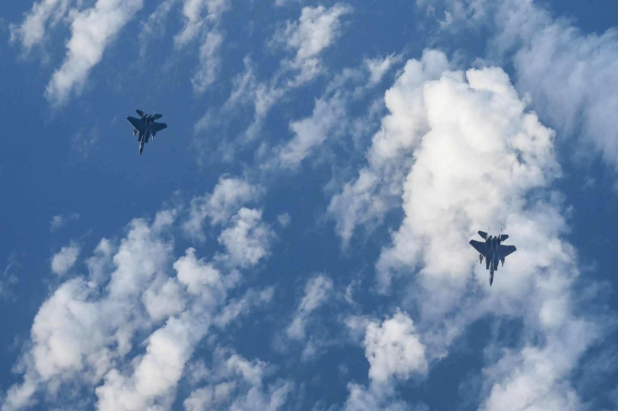 Aircraft fly in formation.