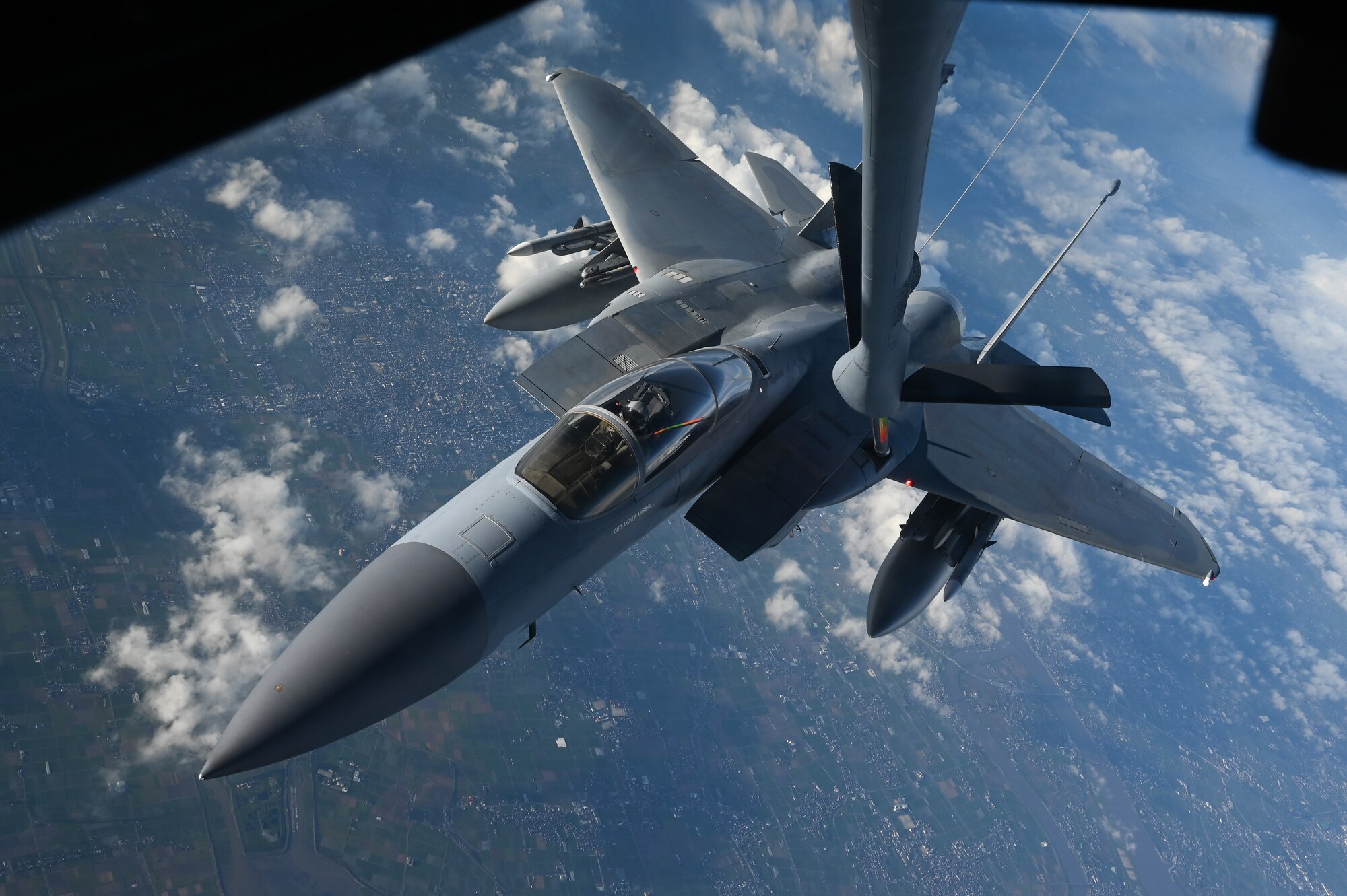 An aircraft conducts aerial refueling.