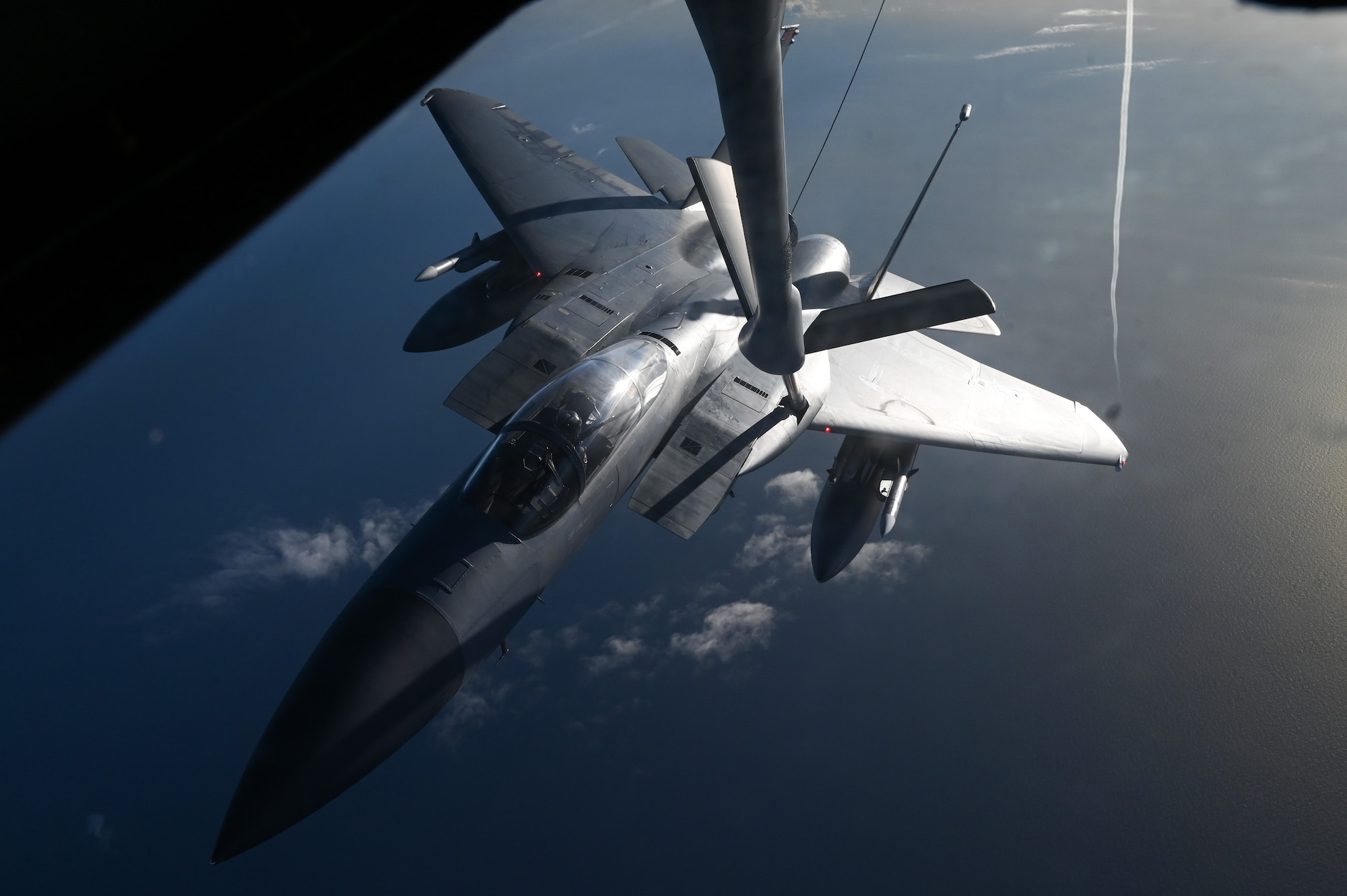 A F-15 conducts aerial refueling.