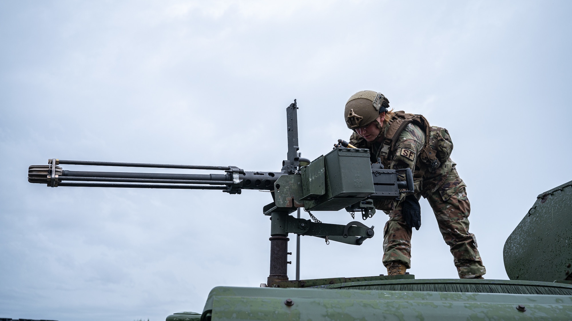 Airman 1st Class Devalcalamoin McLaughlin, 8th Security Forces Squadron installation entry controller, reloads a mounted armament during a base wide training event