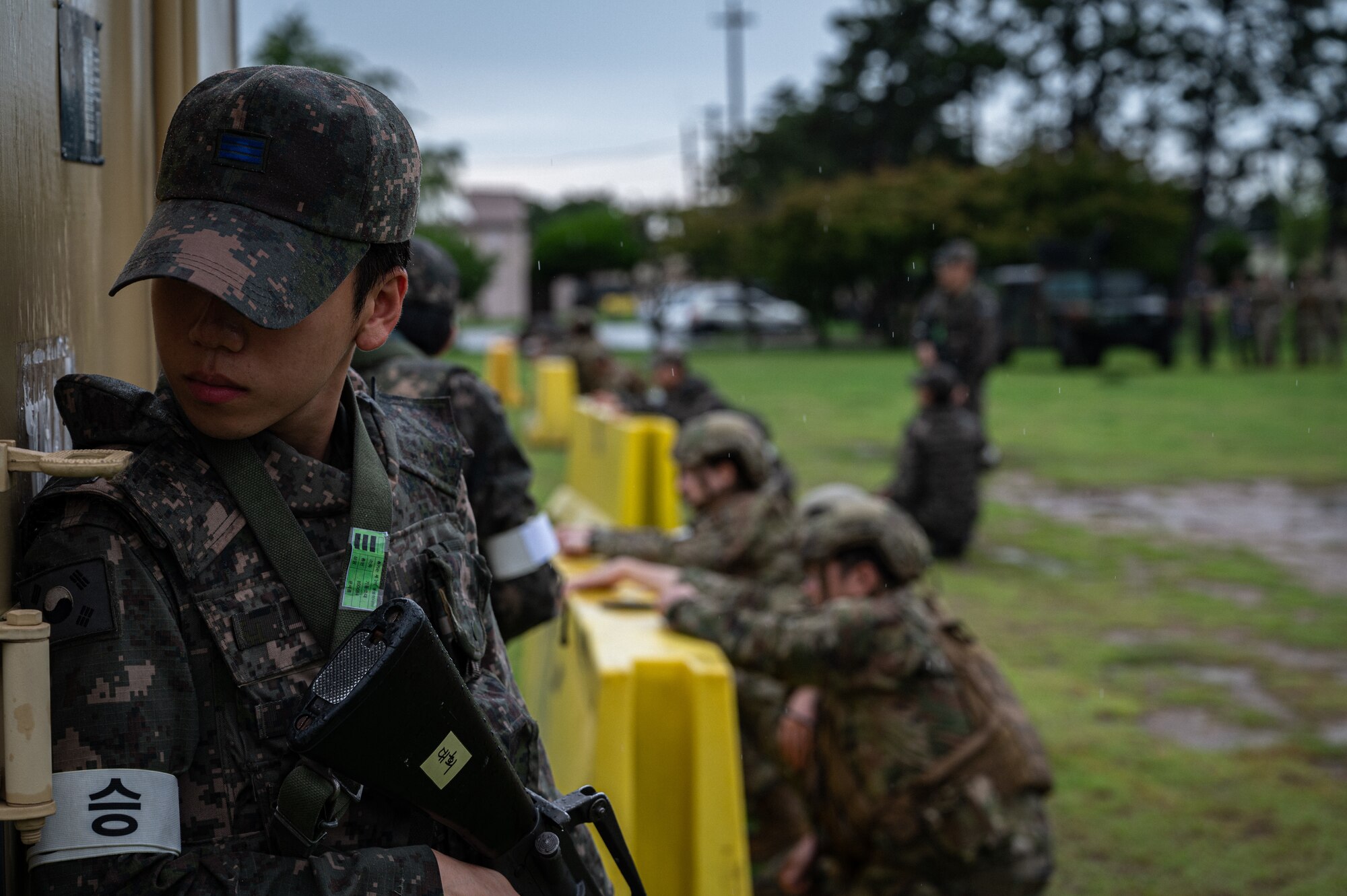 A Republic of Korea Air Force military policeman from the 38th Fighter Group holds position during an exercise event at Kunsan Air Base