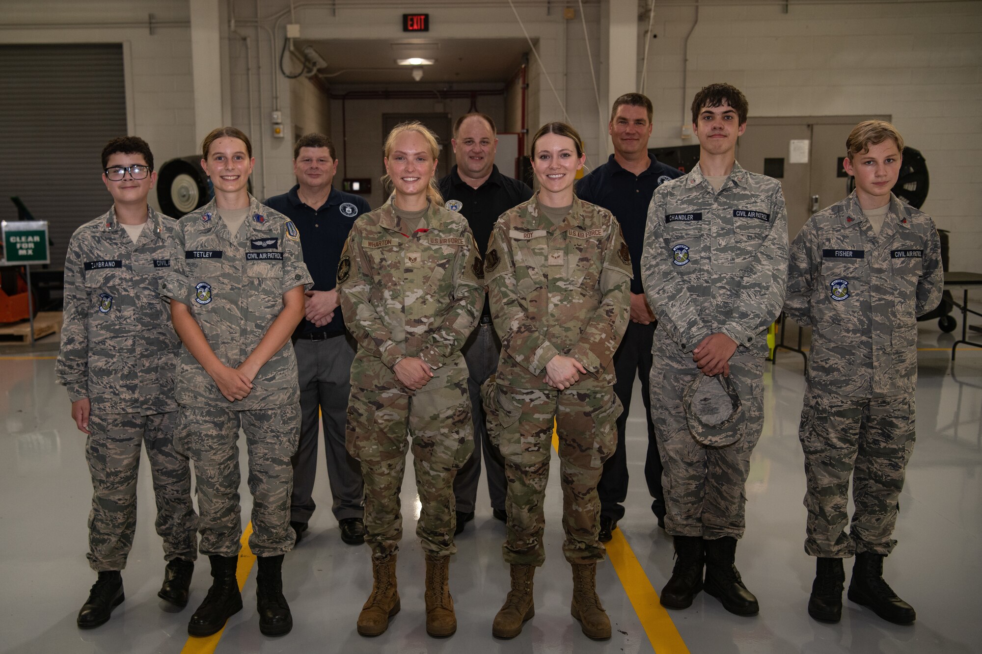Airmen and Cadets pose for a photo.