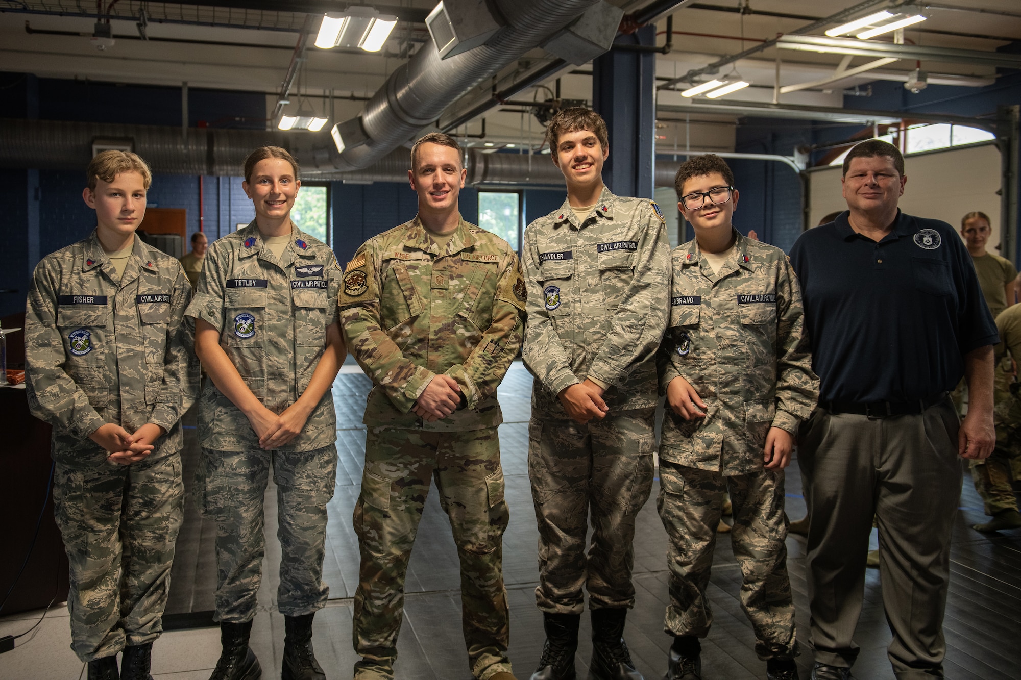 Six cadets pose for a group photo.
