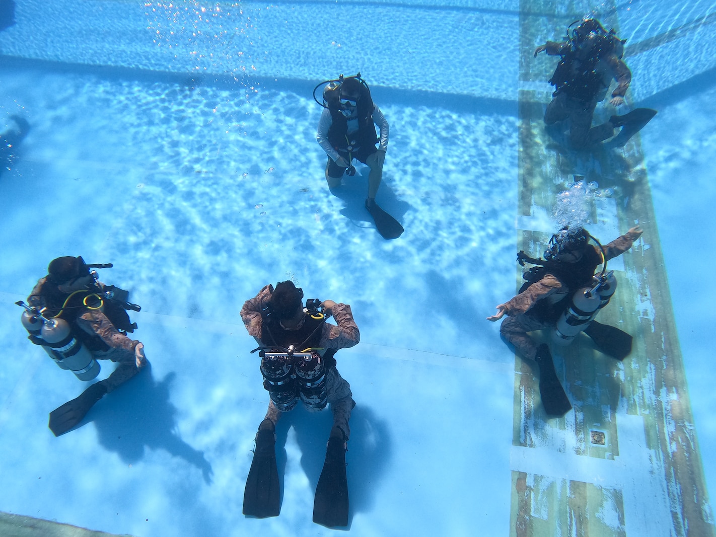 U.S. Marines test their SCUBA gear during dive sustainment training on Camp Schwab, Okinawa, Japan, July 6, 2023. 3d Reconnaissance Battalion conducted dive sustainment training to maintain proficiency of advanced insertion and extraction methods.