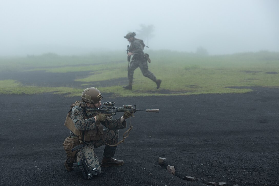 U.S. Marine Corps Lance Cpl. Kevin Kerns, bottom left, and Lance Cpl. Richard Hughes cover each other’s movements during fireteam maneuver training at Combined Arms Training Center Camp Fuji, Japan, June 12, 2023. Fireteam level training allows Marines to refine small-unit tactics, developing proficiency at the lowest level before executing combined arms-training. Kerns, a native of Charles Town, West Virginia, and Hughes, a native Greensboro, North Carolina, and both riflemen with 3d Battalion, 6th Marines who are currently forward-deployed with 4th Marines, 3d Marine Division in the Indo-Pacific under the Unit Deployment Program.