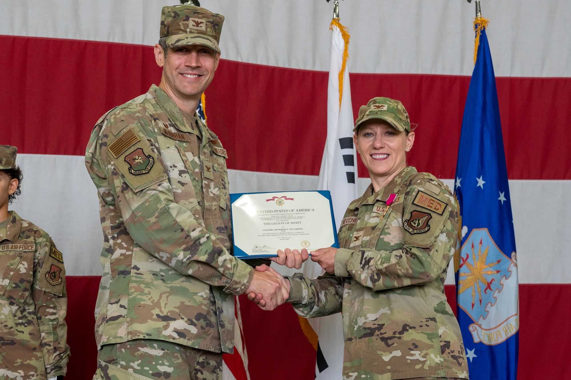 U.S. Air Force Col. William McKibban, left, 51st Fighter Wing commander, presents a Meritorious Service Medal (MSM) to Col. Jennifer Vecchione, 51st Medical Group outgoing commander, at Osan Air Base, Republic of Korea, July 12, 2023. The MSM is a military decoration awarded by various branches of the Armed Forces to recognize distinguished or outstanding meritorious service. (U.S. Air Force photo by Senior Airman Aaron Edwards)
