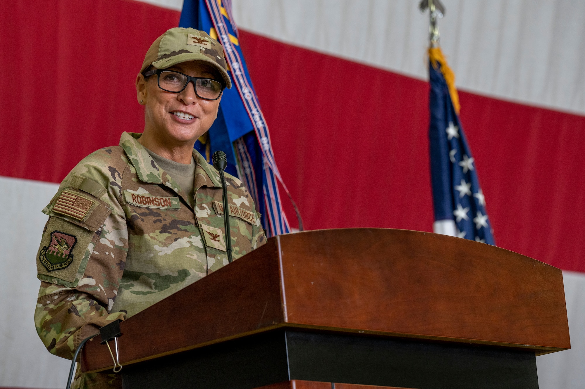 U.S. Air Force Col. Mocha Robinson, 51st Medical Group incoming commander, gives her first speech to her group during a change of command ceremony at Osan Air Base, Republic of Korea, July 12, 2023. Change of command ceremonies are time-honored traditions deeply-rooted in American military history. (U.S. Air Force photo by Senior Airman Aaron Edwards)