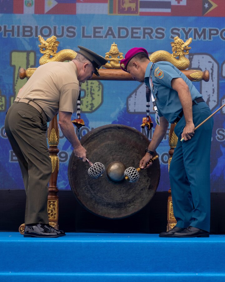 U.S. Marine Corps Lt. Gen. William M. Jurney, left, commander, U.S. Marine Corps Forces, Pacific, and Indonesian Marine Corps Maj. Gen. Nur Alamsyah, commandant, Korps Marinir Republik Indonesia, hit the gong, symbolizing the conclusion of the Pacific Amphibious Leaders Symposium, Bali, Indonesia, July 13, 2023. PALS strengthens our interoperability and working relationships across a wide range of military operations – from humanitarian assistance and disaster relief to complex expeditionary operations. This year's symposium hosted senior leaders from 24 participating nations who are committed to a free and open Indo-Pacific, with the objective of strengthening and developing regional relationships. (U.S. Marine Corps photo by Cpl. Lindheimer)