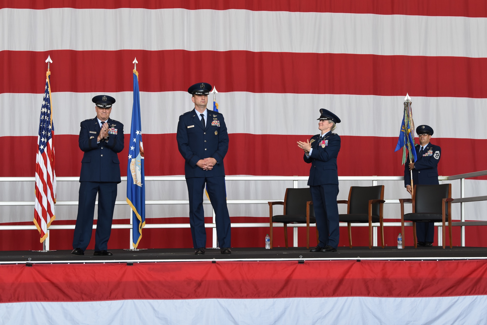 Four people standing on stage