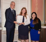 Landstuhl Regional Medical Center (LRMC) staff member Dr. Angela Karnes-Padron, a U.S. Air Force veteran, receives a certificate of appreciation at the Library of Congress, from the Secretary of Veterans Affairs, Denis McDonough, and Lourdes Tiglao, director of the CWV. Karnes-Pardon is one of 21 women selected by the Department of Veterans Affairs Center for Women Veterans (CWV) as a Women Veteran Trailblazers “Women Making the Difference.”