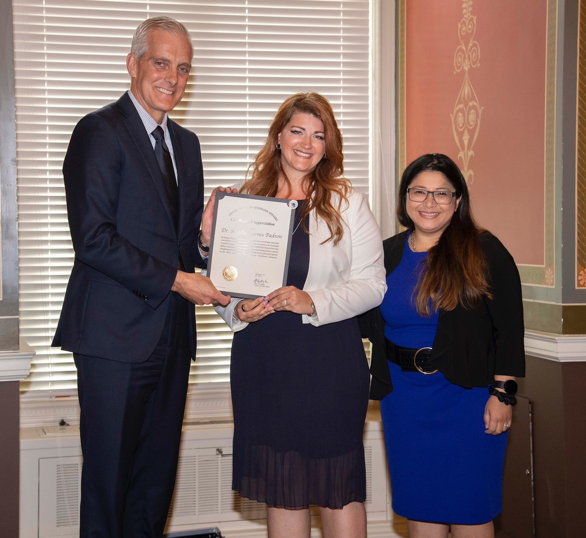 Landstuhl Regional Medical Center (LRMC) staff member Dr. Angela Karnes-Padron, a U.S. Air Force veteran, receives a certificate of appreciation at the Library of Congress, from the Secretary of Veterans Affairs, Denis McDonough, and Lourdes Tiglao, director of the CWV. Karnes-Pardon is one of 21 women selected by the Department of Veterans Affairs Center for Women Veterans (CWV) as a Women Veteran Trailblazers “Women Making the Difference.”