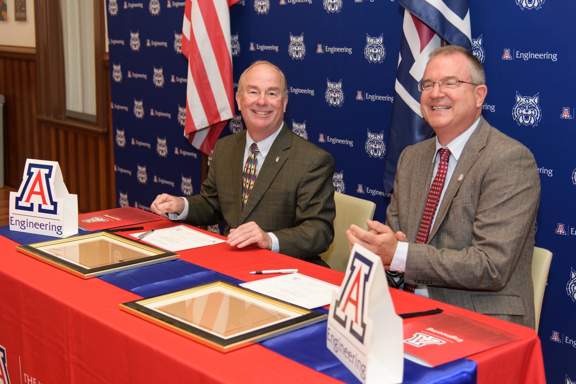 Edward Ayer, Air Force Sustainment Center, and and David Hahn, University of Arizona, sign an Education Partnership Agreement between Hill Air Force Base and the university that establishes collaborations for internships, Interdisciplinary Capstone projects, student training as part of the new Defense Civilian Training Corps program, and potentially faculty research.  (Photo by Kate Gardiner)