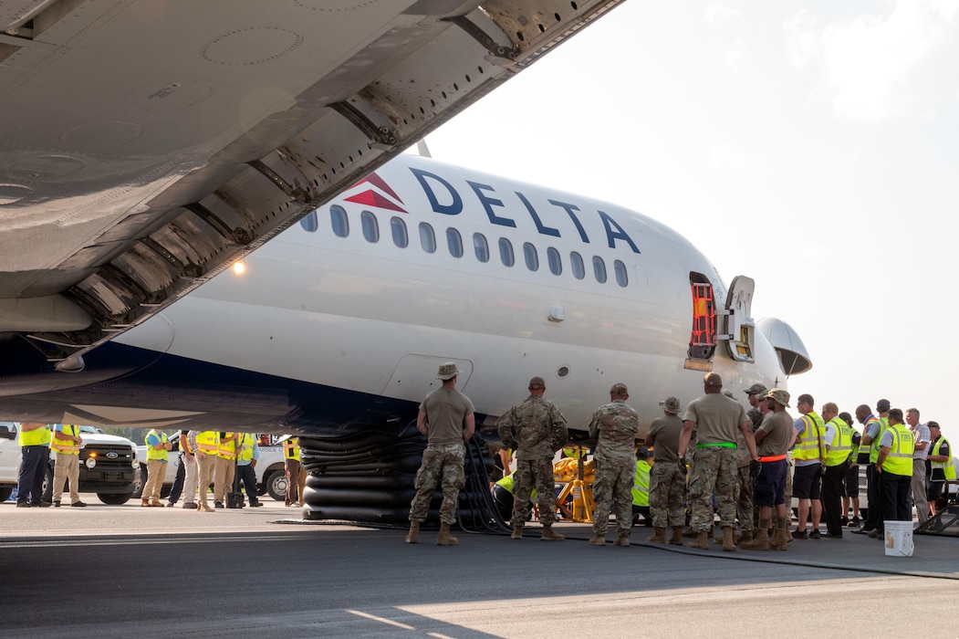 North Carolina Air National Guard assists with aircraft lift due to Delta Airlines flight 1092 making an emergency landing on the Charlotte-Douglas International Airport’s runway June28.