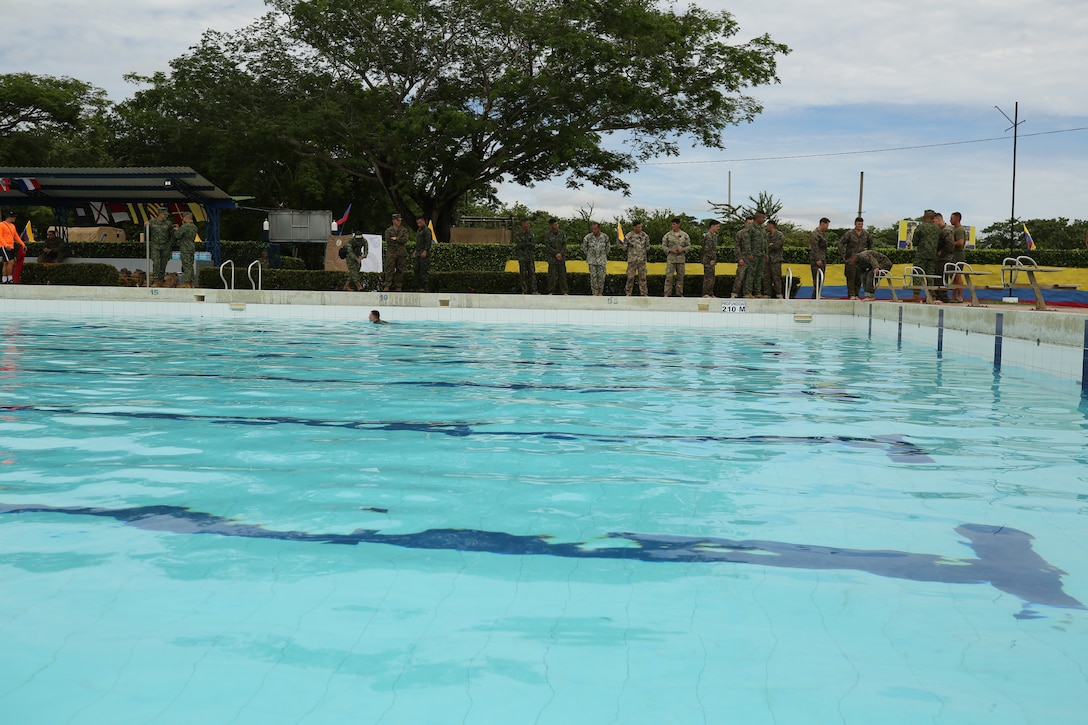 U.S. Marines with 23rd Marine Regiment, 4th Marine Division, in support of Special Purpose Marine Air-Ground Task Force UNITAS LXIV, and partner nation militaries, receive instruction from the Colombian Naval Infantry, on a water survival course during exercise UNITAS LXIV, aboard Escuela de Formación de Infantería Marina Coveñas in Coveñas, Colombia, July 12, 2023. UNITAS is the world’s longest-running maritime exercise. Hosted this year by Colombia, it brings together multinational forces from 20 partner nations, including 26 warships/vessels, three submarines, 25 aircraft (fixed wing/helicopter) and approximately 7,000 people. The exercise trains forces in joint maritime operations that enhance tactical proficiency and increase interoperability with the presence of unmanned air, surface, and submarine systems. (U.S. Marine Corps photo by Sgt. Emily Kirk)