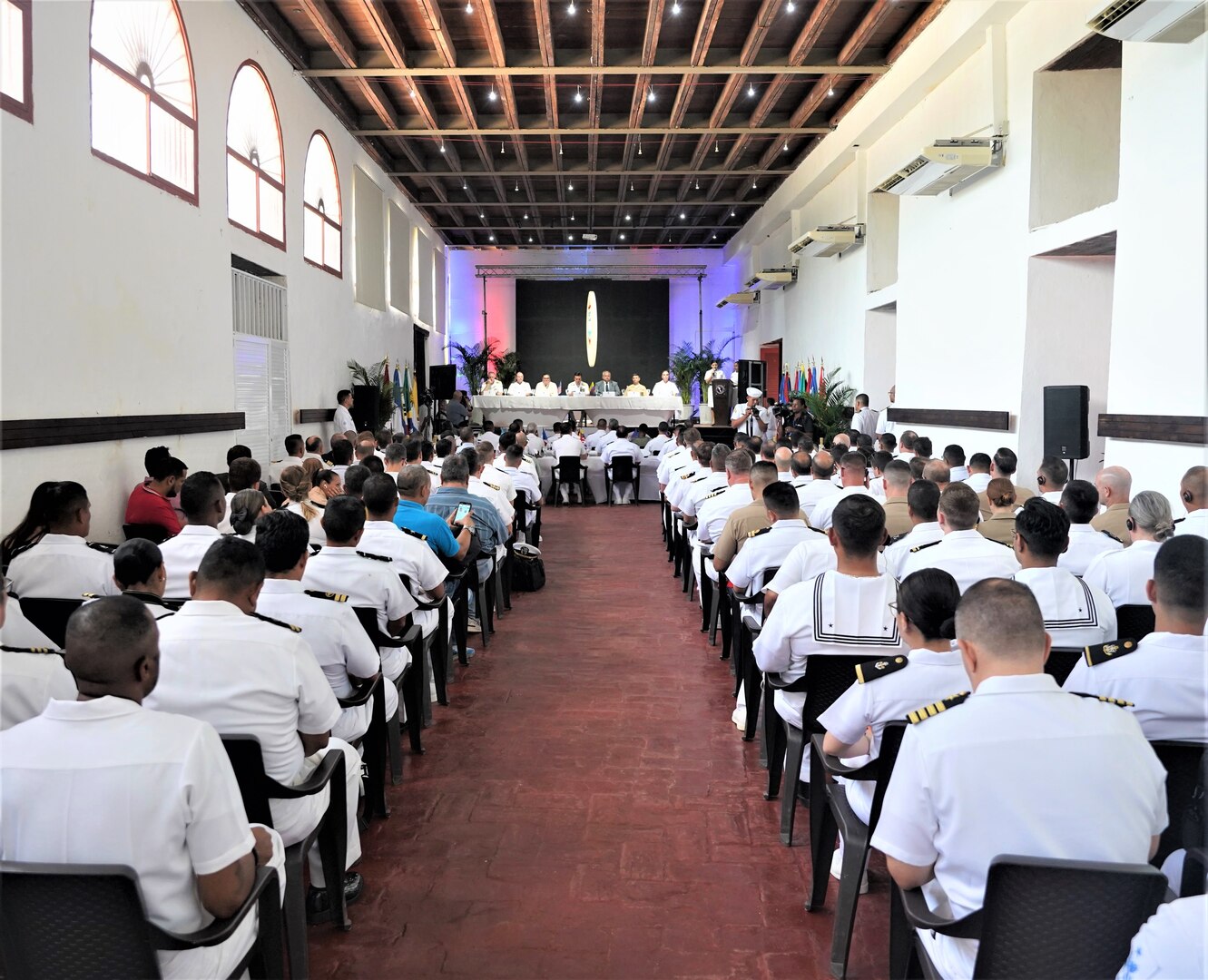 Sailors and Marines from 20 partner nations attend the official opening ceremony of UNITAS LXIV, at the Colombian Naval Museum, Cartagena, Colombia, July 12, 2023. UNITAS, which is Latin for “unity,” was conceived in 1959 and has taken place annually since first conducted in 1960. This year marks the 64th iteration of the world’s longest-running annual multinational maritime exercise. Additionally, this year the Colombian Navy will celebrate its bicentennial. The exercise focuses on enhancing interoperability amongst the partnered nations and joint forces during littoral and amphibious operations in order to build on existing regional partnerships and create new enduring relationships that promote peace, stability and prosperity in the U.S. Southern Command’s area of responsibility. (U.S. Marine Corps photo by Maj. Jeremy Wheeler)
